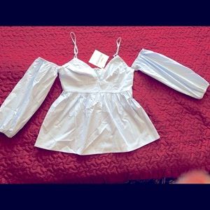 Medium size light baby blue blue blouse
